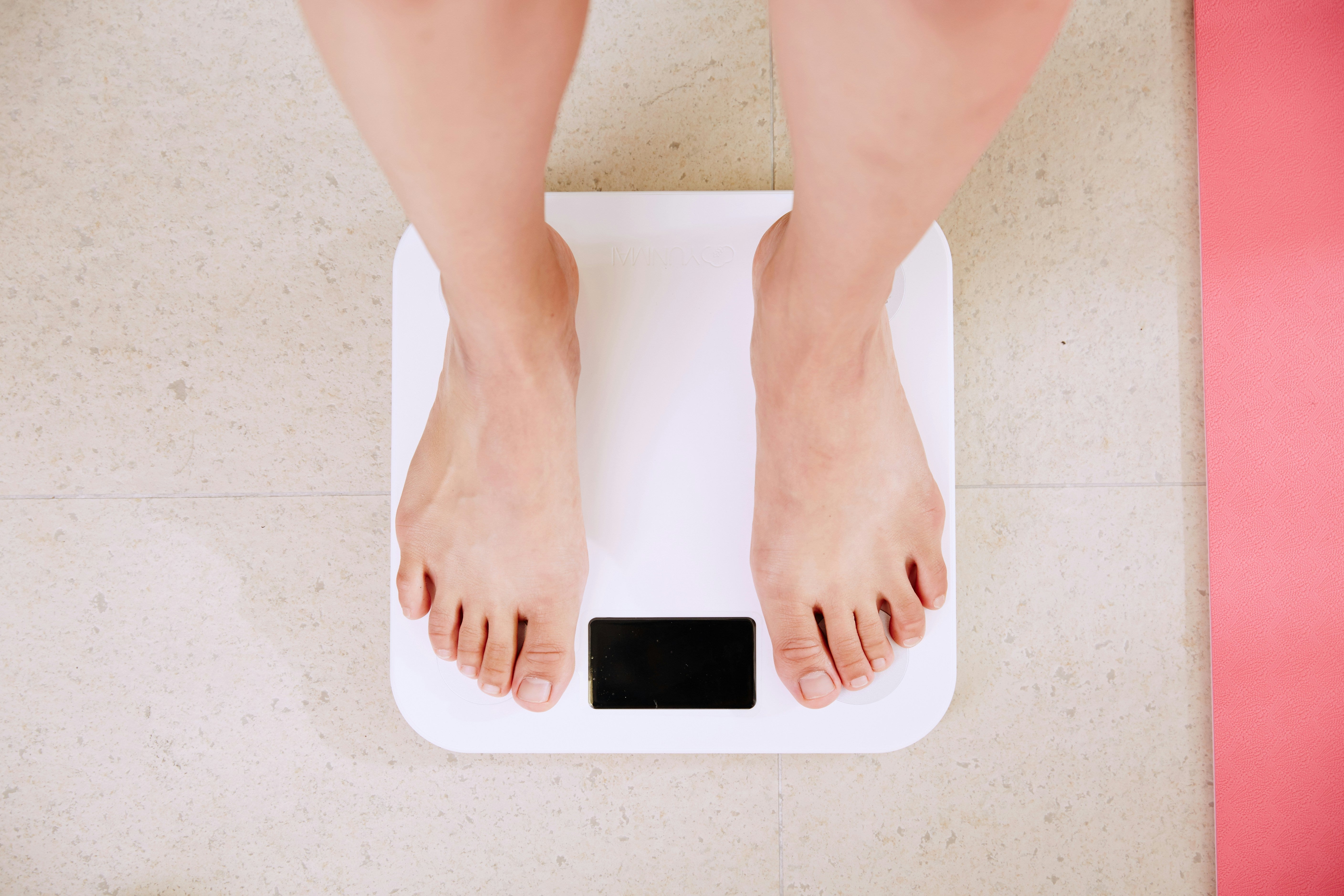 standing on a set of weight scales